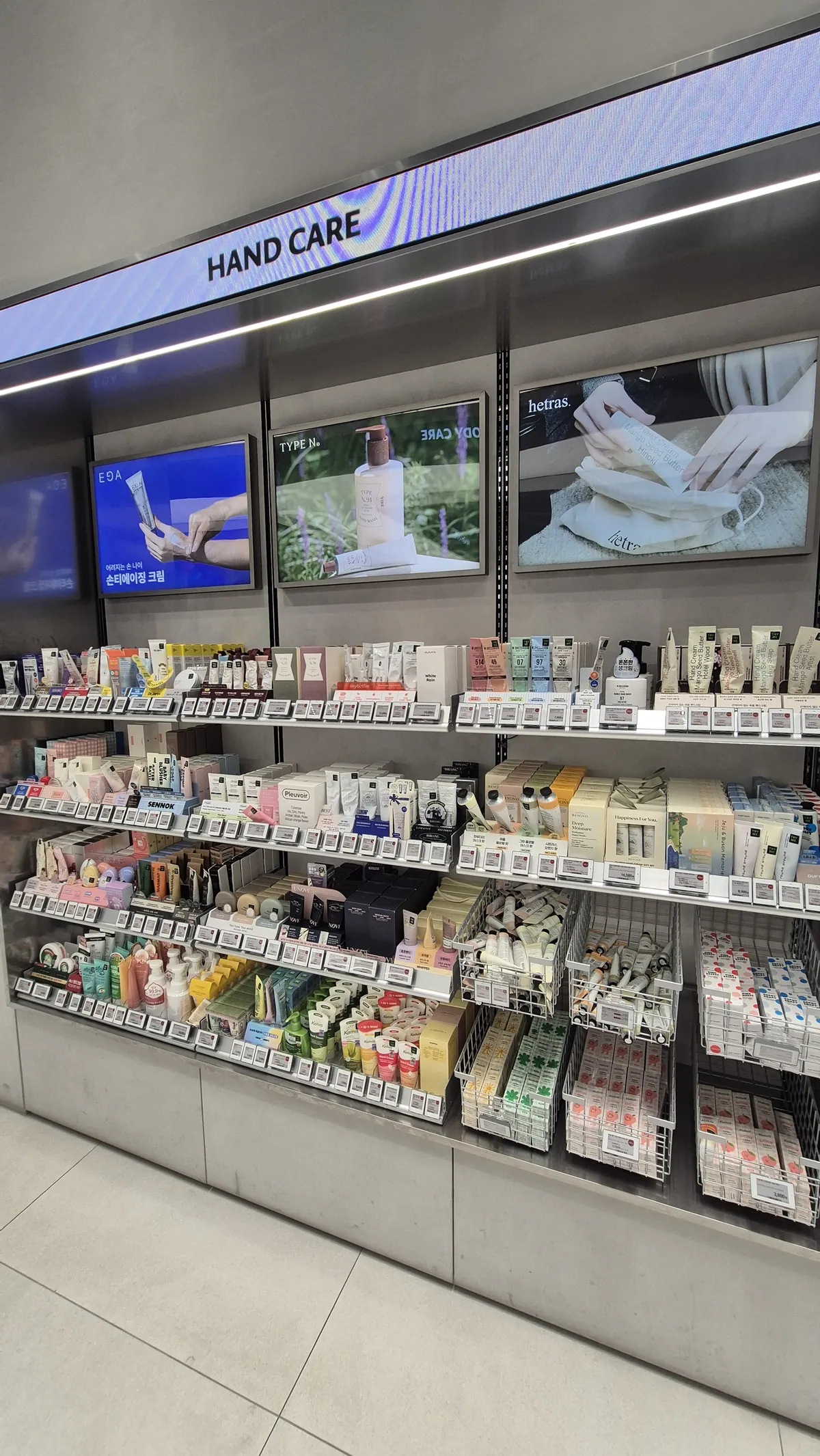 Hand creams and hand care products displayed at Olive Young in Seoul