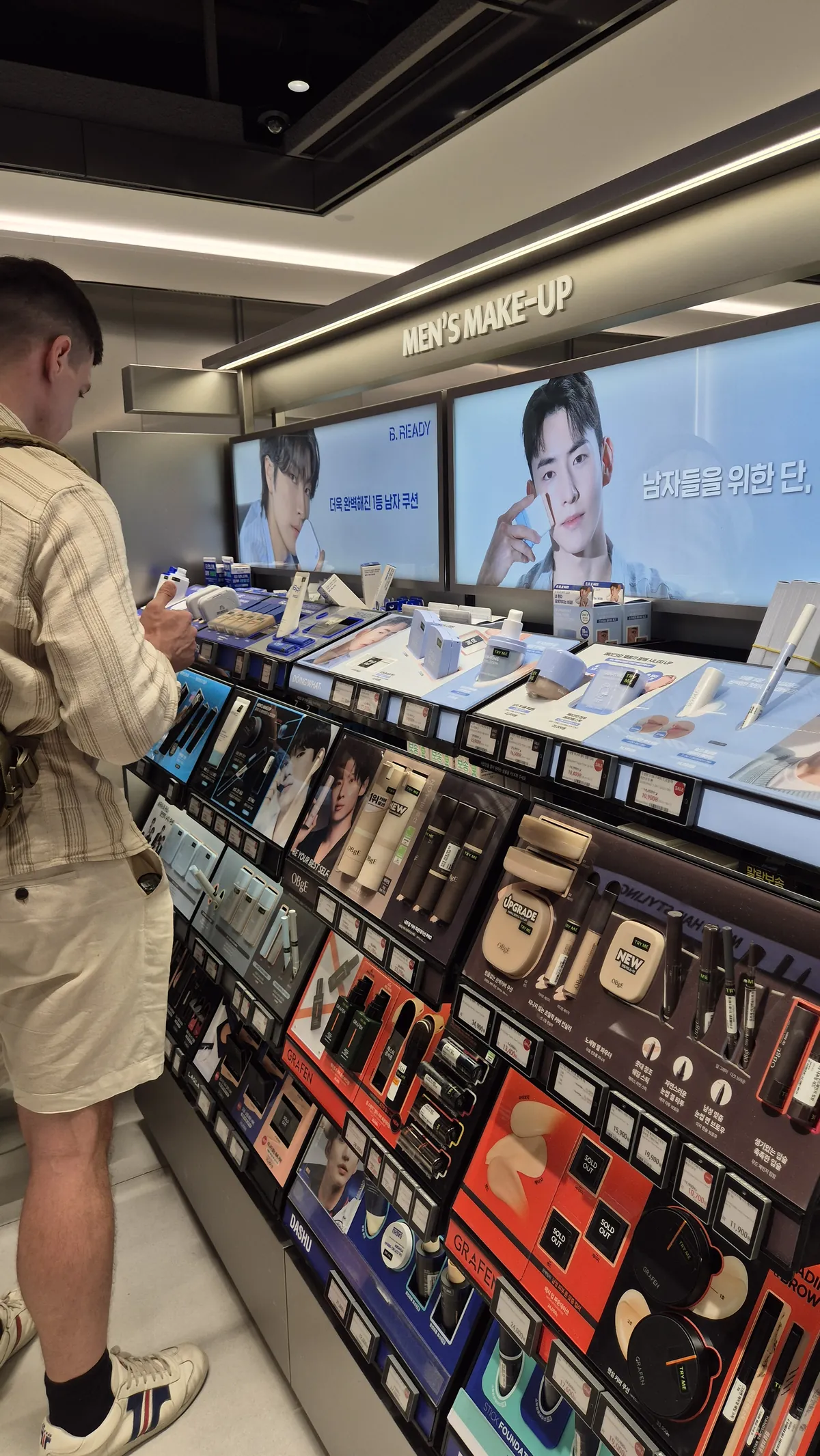 Men's skincare grooming and makeup section at Olive Young in Seoul
