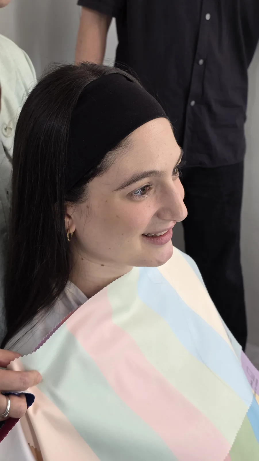Pastel color drapes compared during a personal color analysis in Seoul